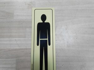 cartel hombre adhesivo 16.5x4.5cm
